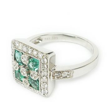 Prsten z bílého zlata s brilianty a smaragdy velikost 54